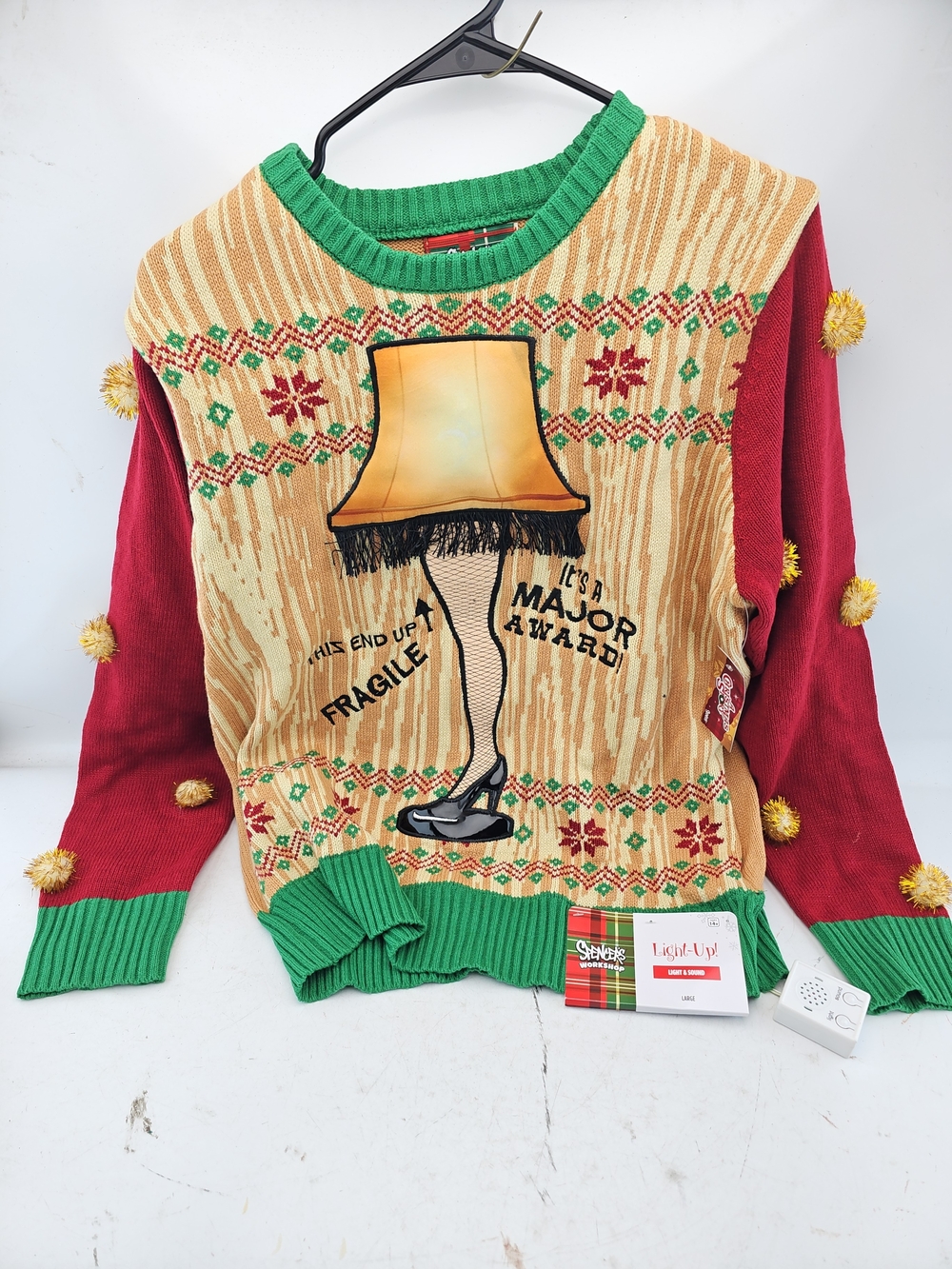 Spencer's Beige, Red & Green Leg Lamp Novelty Crewneck Sweater